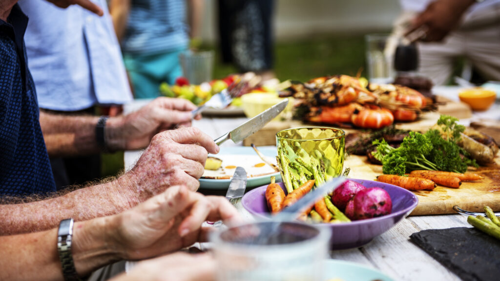 Closeup Of Diverse People Enjoying Barbecue Party Together
