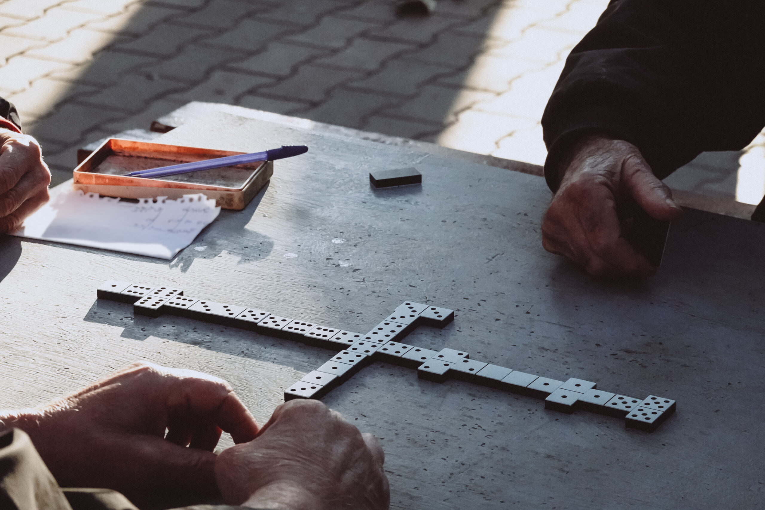 People Playing The Domino Game In The Park